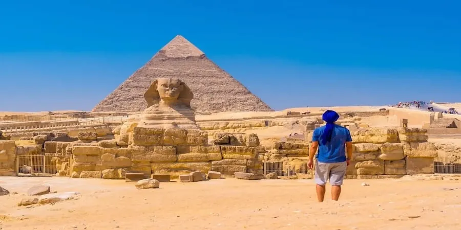 young man walking towards great sphinx giza 1 young man walking towards great sphinx giza 1